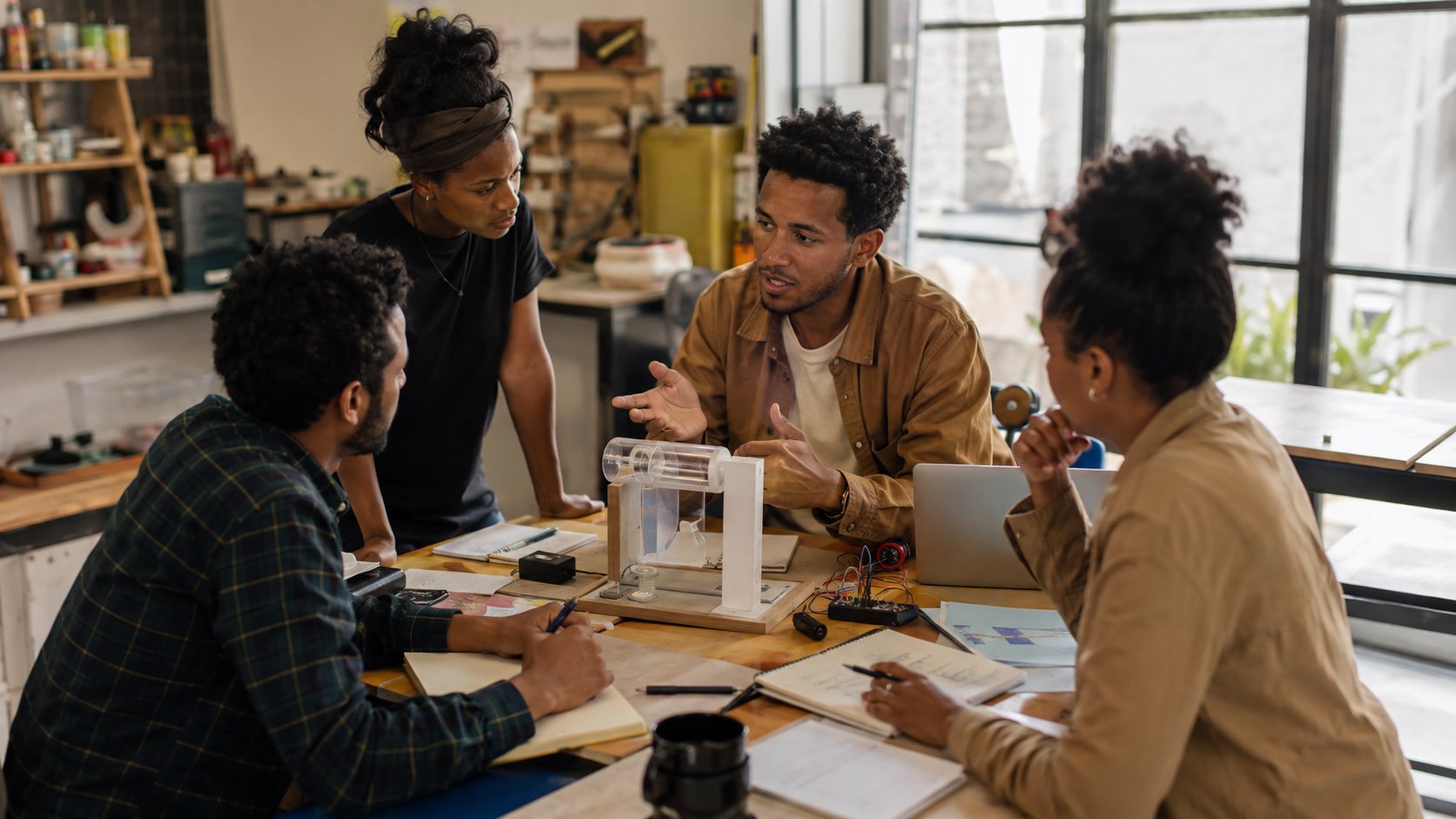 Entrepreneurs reviewing a prototype and customer evidence together